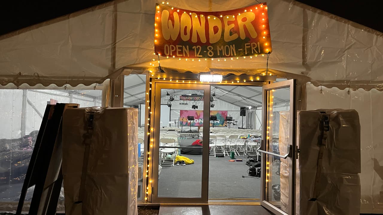 Setting up lights around the outdoor Wonder sign